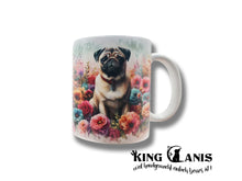 Lade das Bild in den Galerie-Viewer, Tasse mit Mops in beige sitzend in einem Blumenmeer